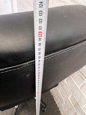 Black Padded Office Armchair on Wheels (Peeling Pleather)