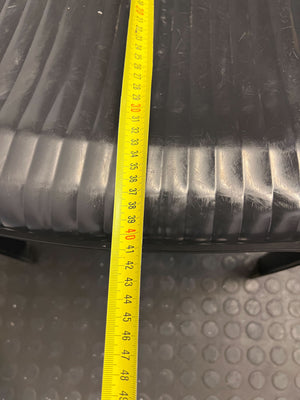 Sturdy Black Plastic Chair with Armrests โ Durable & Easy to Clean