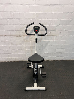 Compact White Exercise Bike with Minor Wear โ Perfect for Home Workouts
