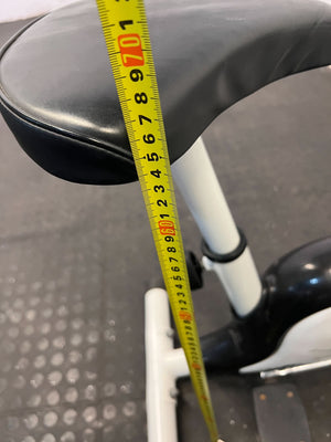 Compact White Exercise Bike with Minor Wear โ Perfect for Home Workouts