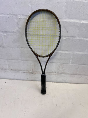 Tennis racket with a textured surface on a light gray background