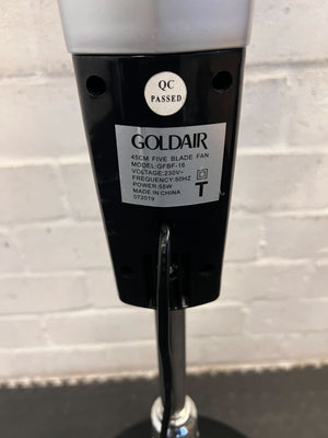 Goldair five blade fan with a label on a light gray background