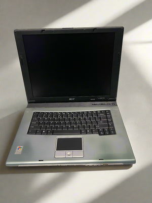 Open laptop on a light surface with Acer branding