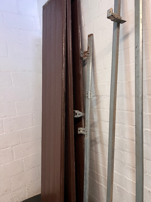 Brown Metal Sectional Garage Door with Motor and Tracks — One Door With Snapped Tensioner; Both Motors Working