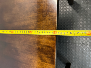 Classic Rectangular Wood-Tone Dining Table — Visible Wear and Surface Discolouration