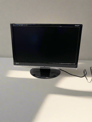 Monitor on a white surface with a neutral background
