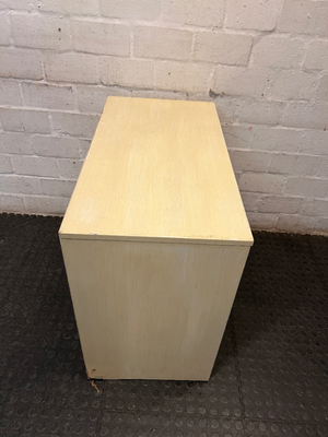 Cream Four-Drawer Chest with Moulded Panelling — Fair Condition with Visible Wear