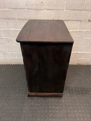 Dark Stained Wooden 4-Drawer Chest — Visible Wear and Surface Marks