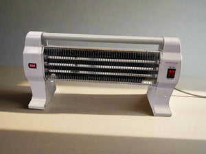 Portable electric heater on a neutral background
