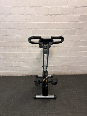 Grey and Black X-Frame Stationary Exercise Bike — Fair Used Condition
