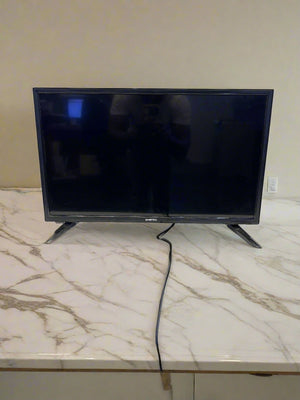 A 32-inch SinoTec LED TV with a modern black finish, displaying minor scratches, placed on a white surface.