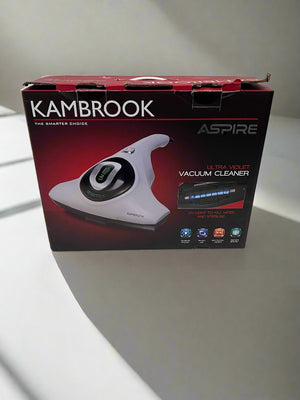 Kambrook vacuum cleaner box on a white floor with gray wall background