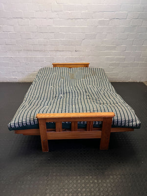 Versatile Pine Futon Sofa Bed with Patterned Cushion