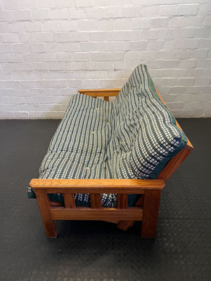 Versatile Pine Futon Sofa Bed with Patterned Cushion