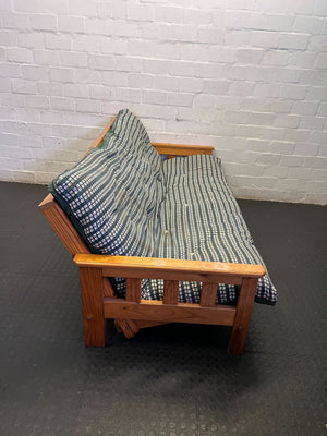 Versatile Pine Futon Sofa Bed with Patterned Cushion