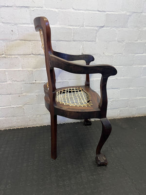 Elegant Vintage Dark Wood Armchair with Woven Seat