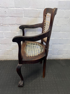 Elegant Vintage Dark Wood Armchair with Woven Seat