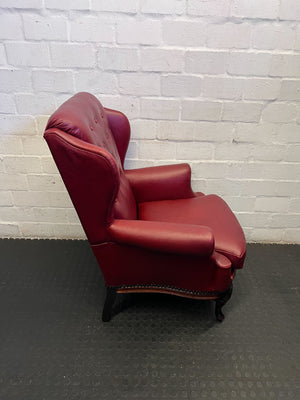 Elegant Vintage Burgundy Leather Wingback Chair with Minor Wear