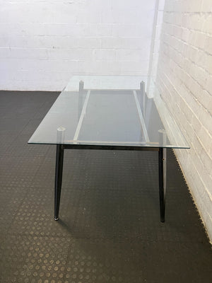 Sleek Glass & Metal Dining Table with Tapered Legs- Fair used