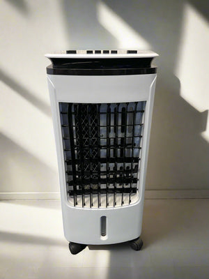 Portable air cooler on a black surface with a gray brick wall background