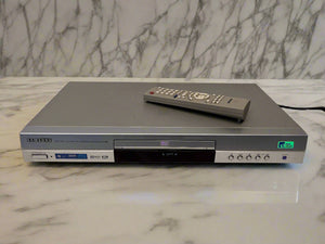 DVD player with remote control on a marble surface