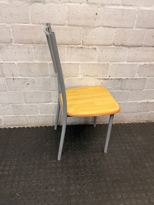 Silver Metal Dining Chair with Wood-Effect Seat — Visible Surface Wear and Scuffing
