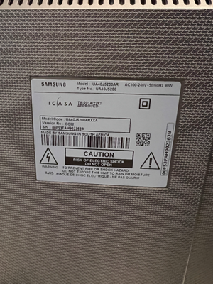 Sleek Black Flat Screen LED Television with Stand — Working Well; Heavily Used Condition