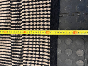 Stylish Black and White Woven Area Rug - Minimalist Design, Slight Wear