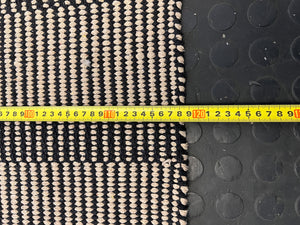 Stylish Black and White Woven Area Rug - Minimalist Design, Slight Wear