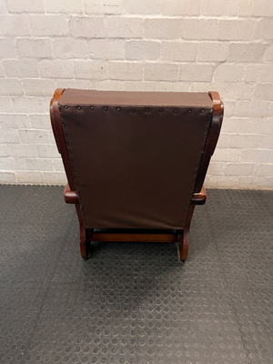 Vintage Brown Vinyl Armchair with Wooden Armrests — Significant Wear and Scratching on Front Edges