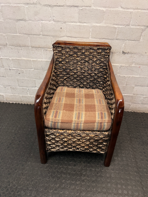 Woven Wicker and Dark Wood Armchair — Fair Used Condition with Faded Cushion