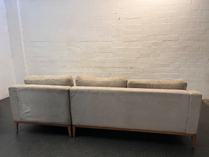 Neutral Fabric L-Shape Sectional Couch with Wooden Base — Well Used L-Shape Couch – condition detail