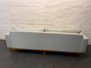 Modern Grey 3 Seater Couch with Tapered Wooden Legs — Small Tear on Cushion – back view
