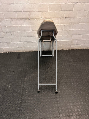 Grey Metal Folding Ironing Board — Fair Condition with Visible Surface Staining – back view