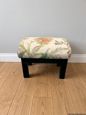 Floral Upholstered Ottoman with Black Timber Legs — Fair Condition With Visible Wear – styled product image