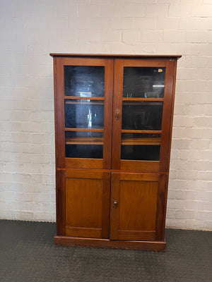 Tall Wooden Glass-Front Display Cabinet — Water Damage Present – main front view