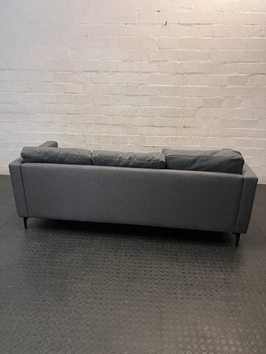 Santino Grey Fabric Fabric Corner Chaise Couch — Fabric Surface Has a Small Coal Burn – condition detail