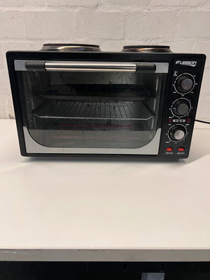 Black Fussion Two-Plate Countertop Stove and Oven — Working Order with Visible Rust – main front view
