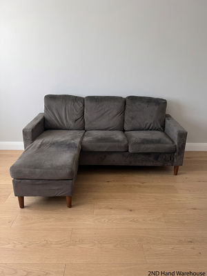 Grey Velvet-Style L-Shape Couch with Tapered Wooden Legs — Well Used Condition – styled product image