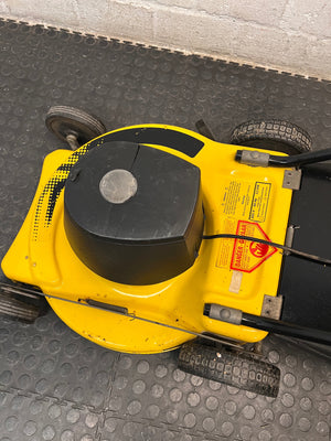 Electric Rotary Lawnmower in Yellow and Black — Trips Power Supply; Non-Functional – top view