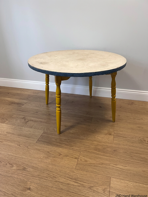 Round Yellow Wood Outdoor Table with Blue Trim — Visible Wear and Surface Staining – styled product image