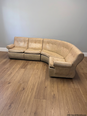 Beige L-Shape Curved Upholstered Corner Couch — Sagging Seats, Thin Padding, and Missing Buttons – styled product image