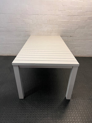 Cream Slatted Metal Outdoor Table — Well Used with General Outdoor Wear – side view