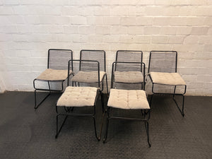 Black Steel Frame Dining Chair with Beige Cushion — Well Used State – side view