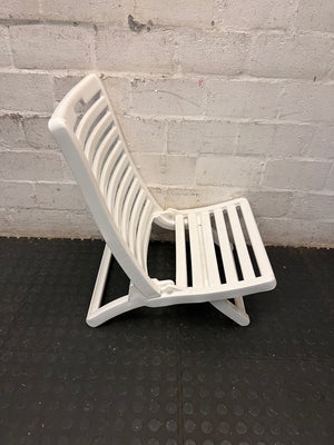 White Slatted Plastic Folding Chair – back view