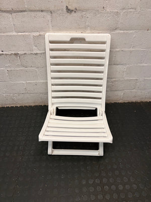 White Slatted Plastic Folding Chair – top view