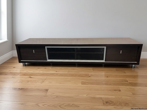 Wide Dark Brown TV Unit with Glass Centre Panel — Fair Used Condition – styled product image