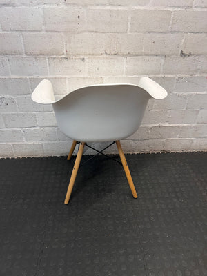 Moulded White Dining Chair with Tapered Wooden Legs — Visible Wear and Surface Marks – back view