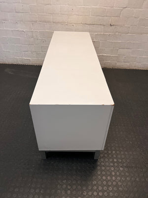 White Four-Drawer TV Unit with Metal Handles — Minor Bump Damage on Front Corners – top view