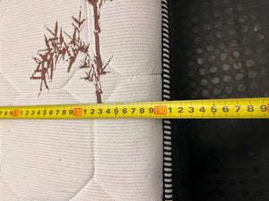 Queen Bamboo Pattern Mattress and Grey Upholstered Base — Mattress in Poor Condition; Base Shows Wear – depth measurement